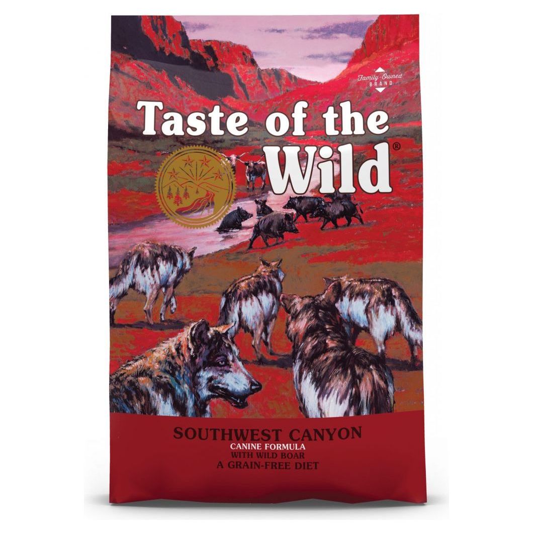 A bag of Taste of the Wild Southwest Canyon Canine dog food with an illustration of wolves on the front.