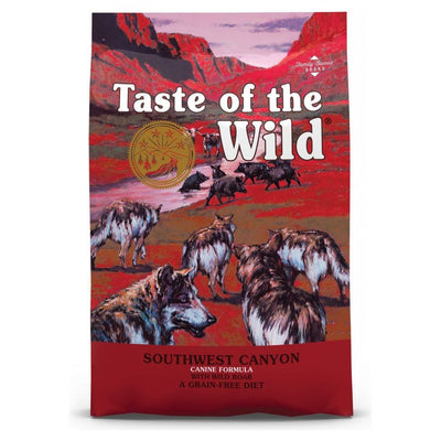 A bag of Taste of the Wild Southwest Canyon Canine dog food with an illustration of wolves on the front.